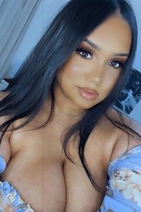 lush woman confidently demonstrating off her curves in risquÃ© lingerie